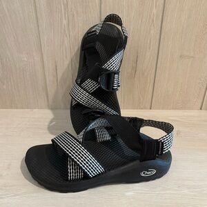 Black and white big strap chacos